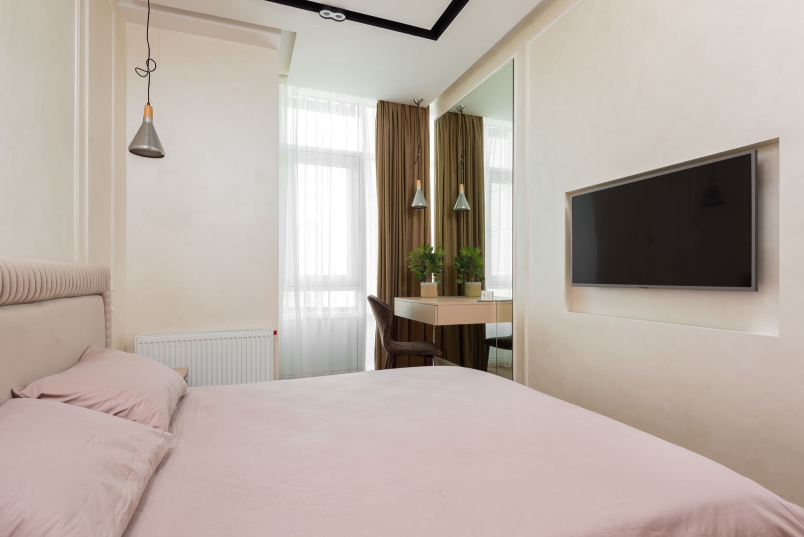 Simple apartment bedroom with bed and mattress, the first furniture purchase to prioritise