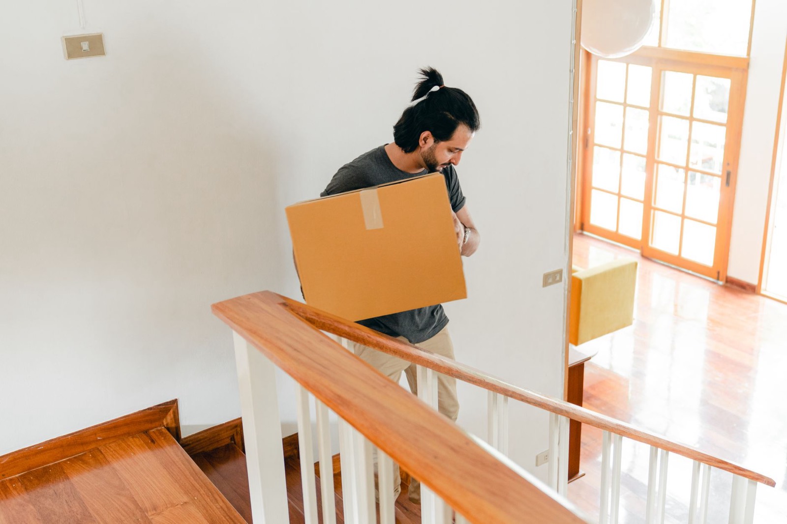 Moving boxes on apartment stairs, showing why delivery access should be measured first