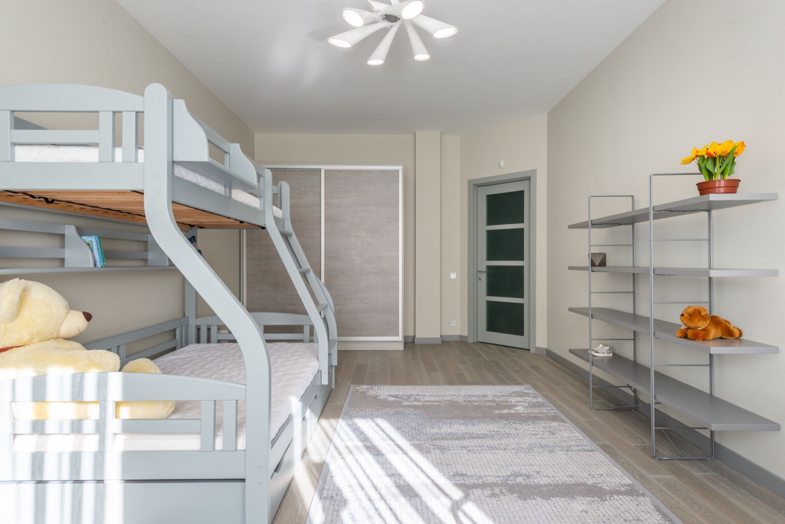Wooden bunk bed in a kids bedroom, the original use case that gave the bunkie board its name