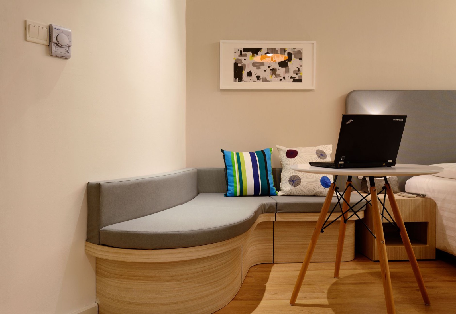 Small bedroom corner layout where a compact vanity reclaims unused space