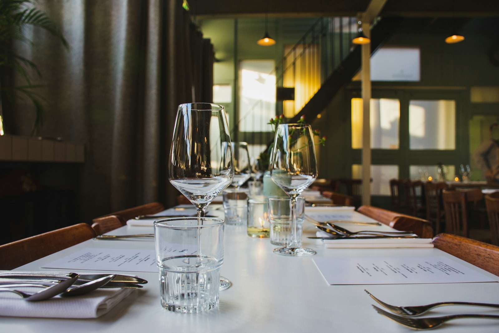 Table set for a meal showing the edge width each diner needs to eat comfortably