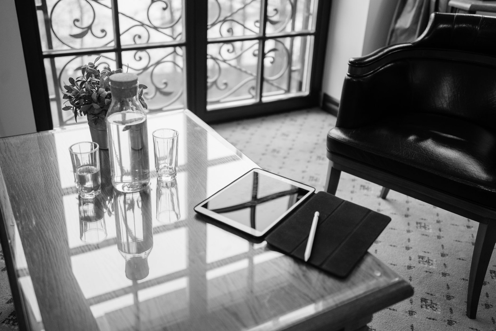 Glass top surface reflecting light, a finish that helps a small bedroom feel larger