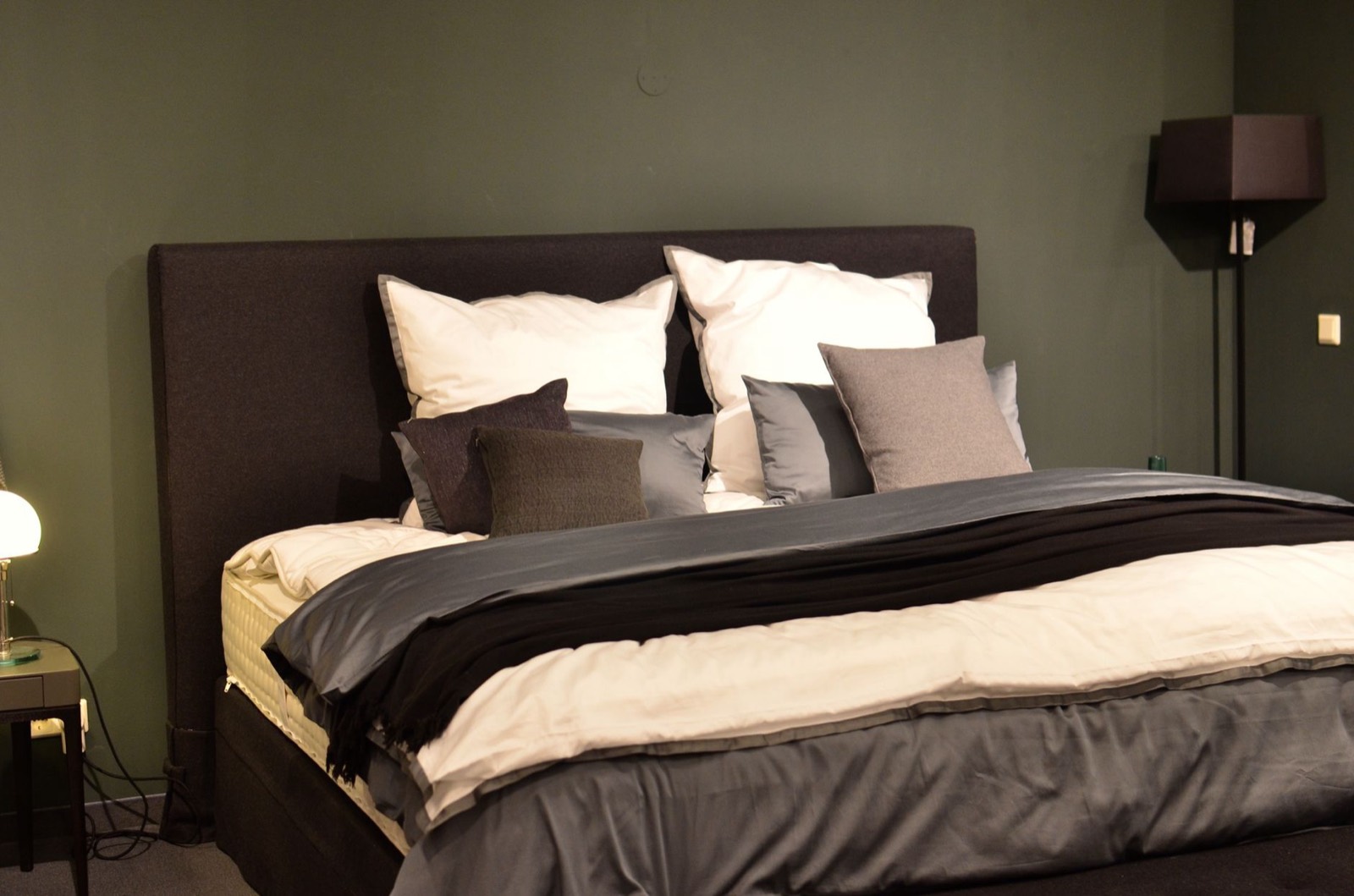 Mattresses displayed side by side in a showroom so shoppers can compare sizes in person