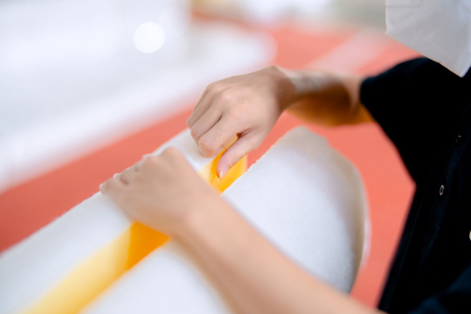Close-up of foam mattress layers showing the contouring comfort material