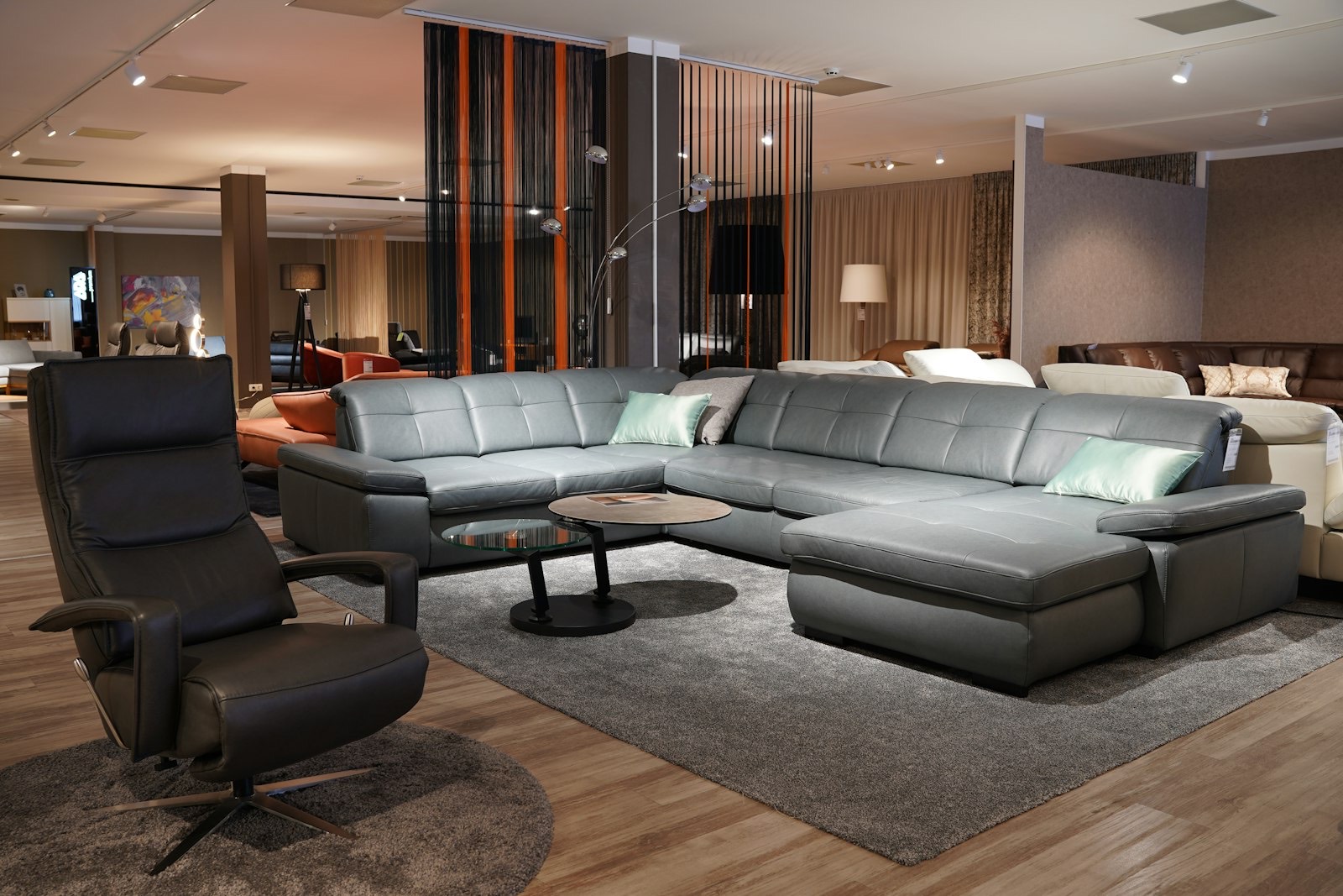 Recliners displayed in a furniture showroom where the full reclining range can be tested