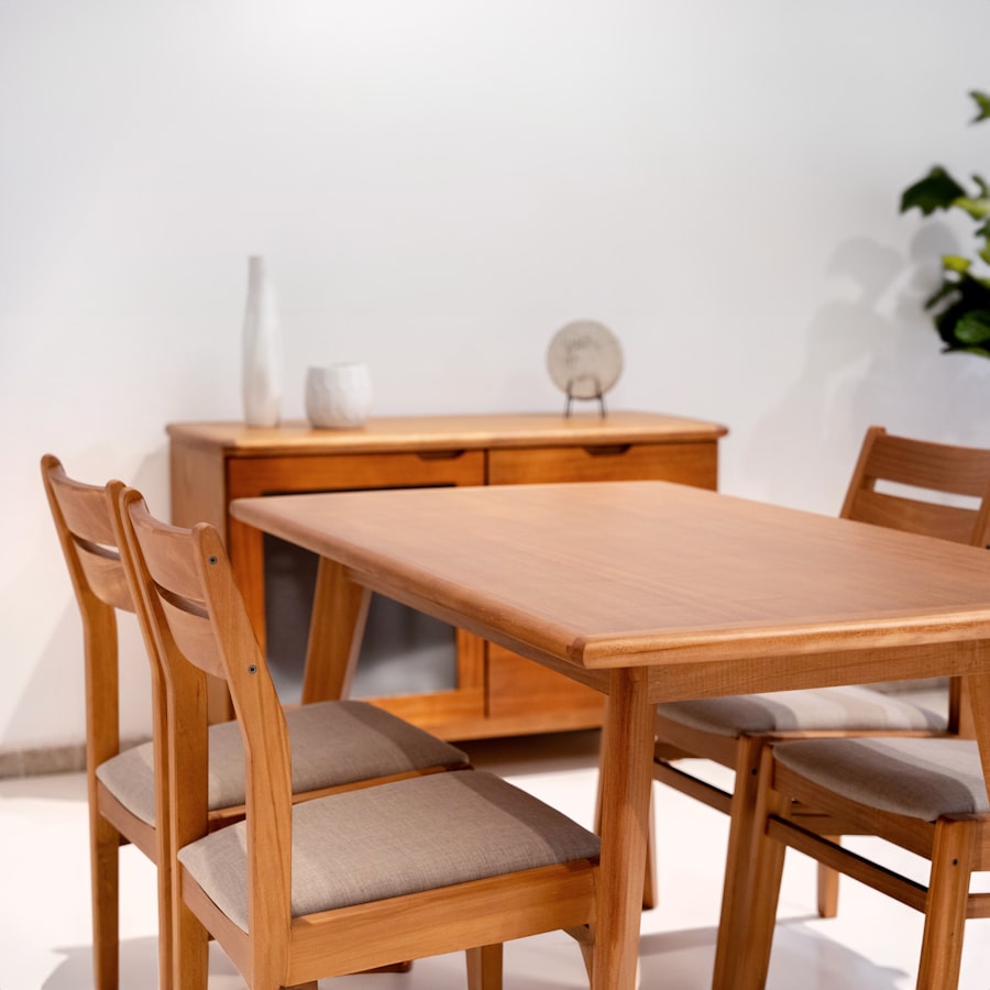 Light wood dining table and chairs with matching sideboard