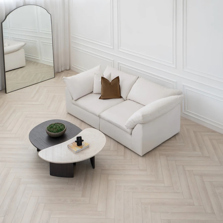 White upholstered loveseat with coffee table
