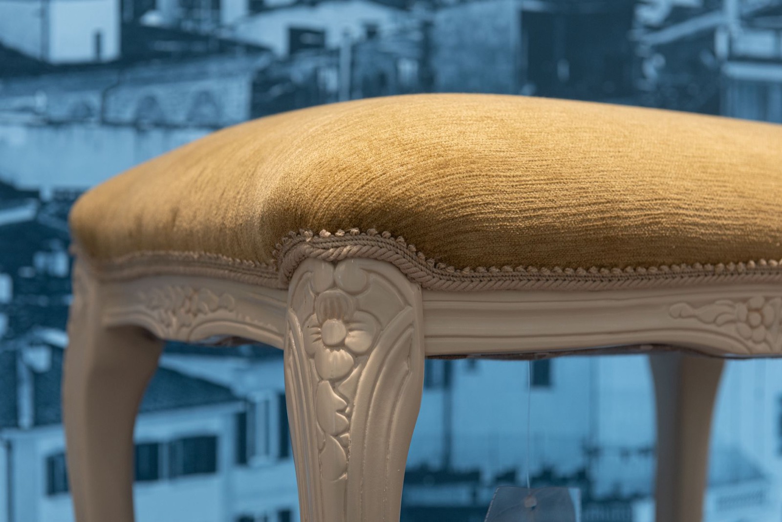 Backless stool that tucks under a vanity tabletop for comfortable seated legroom